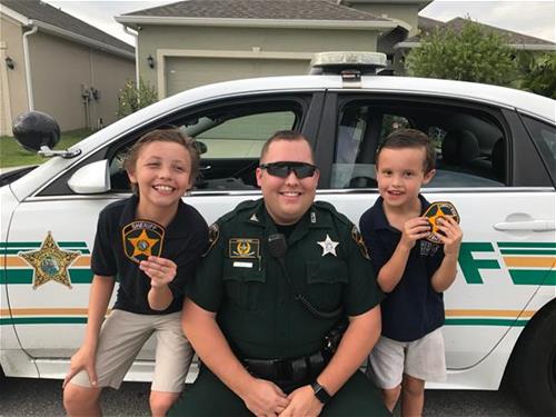 Deputy with kids Deputy with kids in front of patrol car